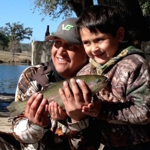Father and Son catching Trophy Rainbow Trout